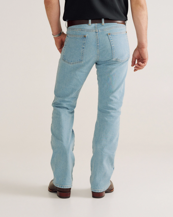 Back view of Men's Modern Bootcut Heritage Denim - Light Blue on model