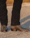 man wearing brown boots