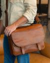 Closeup of man carrying the Bartlett briefcase