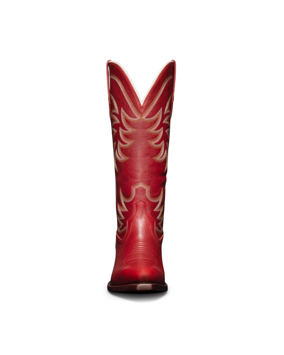 Red leather cowboy boot with intricate stitching, viewed from the back, set against a black background.