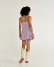 Back view of Women's Sleeveless Collared Mini Dress - Purple on model