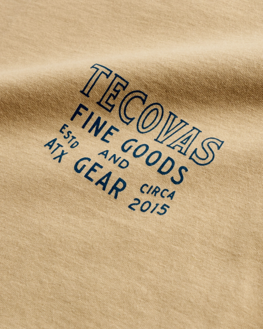 Closeup detail view of Men's Guitar Fine Goods Tee - Khaki / Blue