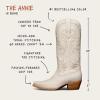 A white cowboy boot with cowhide top to toe, seven-row tonal stitching, signature toe stitching, and a 2" heel. The boot is 14" tall and features a fashion-forward snip toe design.