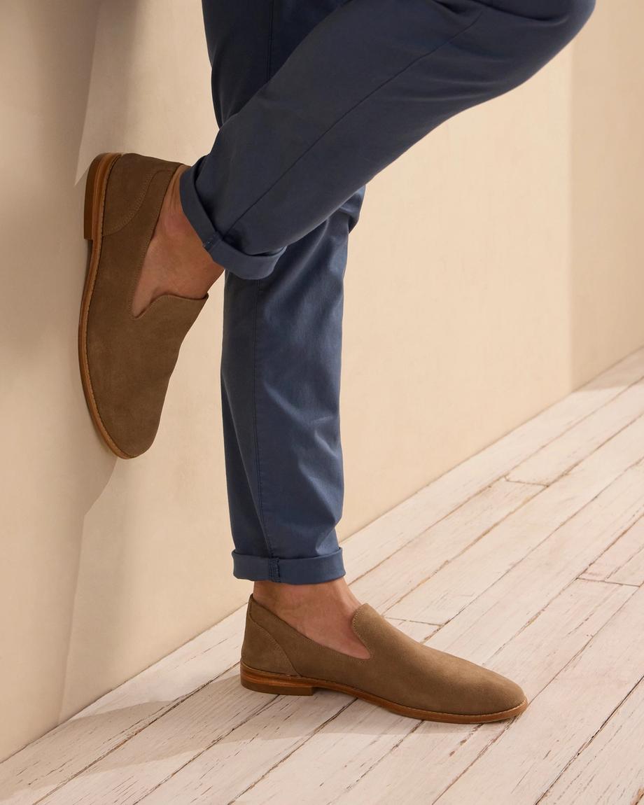 man wearing a granite grey suede slip on shoe