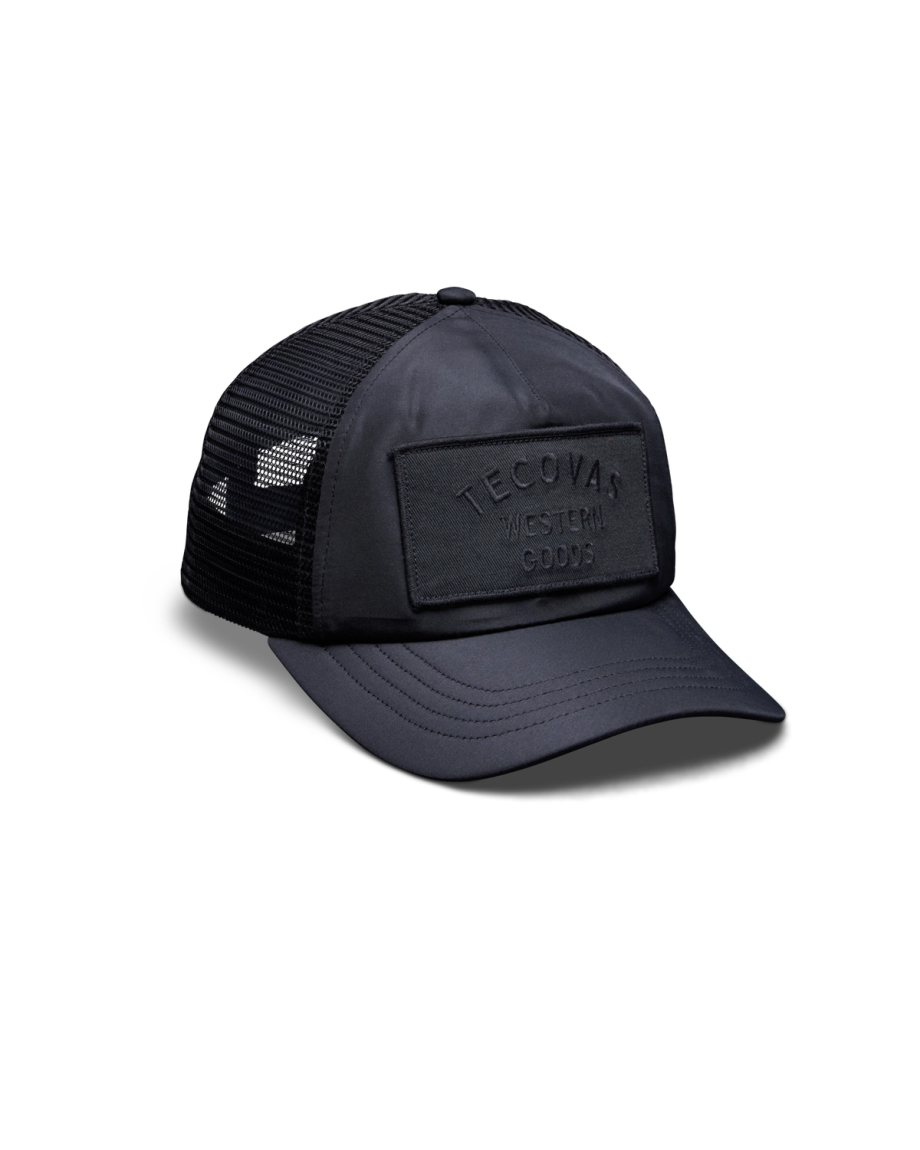 Quarterfront view of Western Goods 5-Panel Low Pro Trucker - Black on plain background