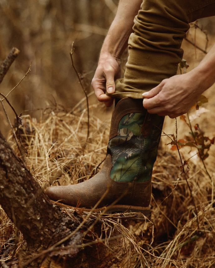 Full view of Tecovas x Mossy Oak Rugged Roper - Full Foliage Cowhide on plain background