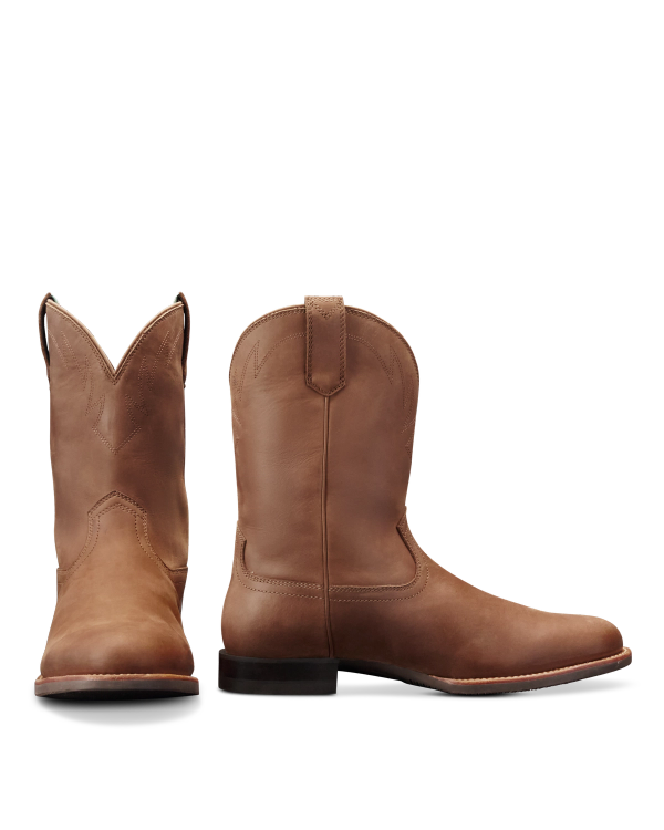 The Glen in Khaki Cowhide. A pair of brown cowhide leather cowboy boots, one facing forward and one showing a side view, both with low heels and pull tabs.