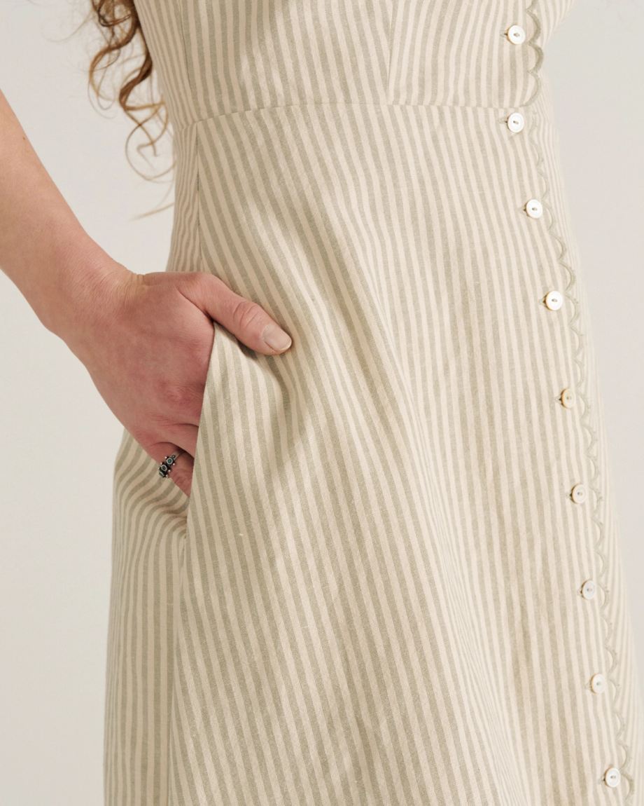 Front view of Women's Eyelet Linen Midi Dress - Green / White on model