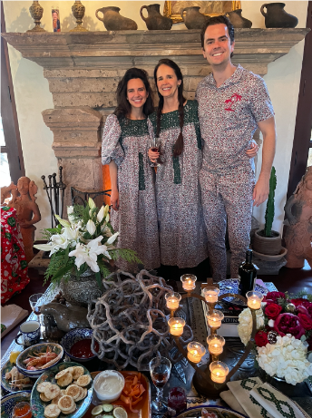 Family standing and hugging in Christmas Pajamas