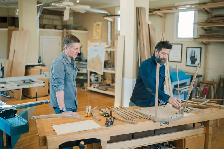 two men working a workshop