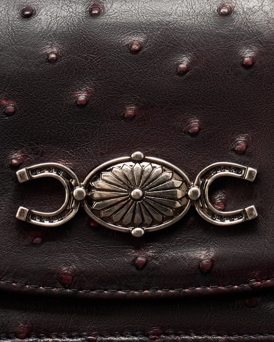 Closeup detail view of Concho Chain Crossbody - Black Cherry