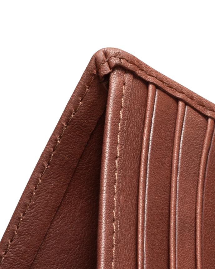 Close-up of a brown leather wallet with visible stitching and multiple card slots.