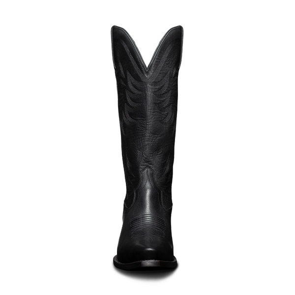 A tall black cowboy boot with stitched patterns, viewed from the front, against a plain background.