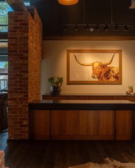 Image of the inside of the Main Street Tecovas Store hide art