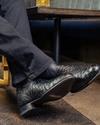 close up picture of Duke Midnight black boots on a man's feet