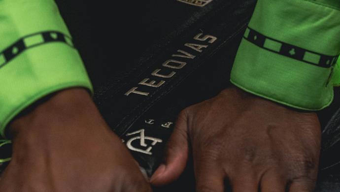 Hands on rodeo uniform with Tecovas logo