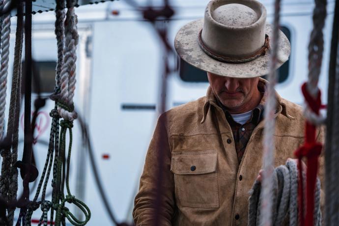 a man in a hat in the rain