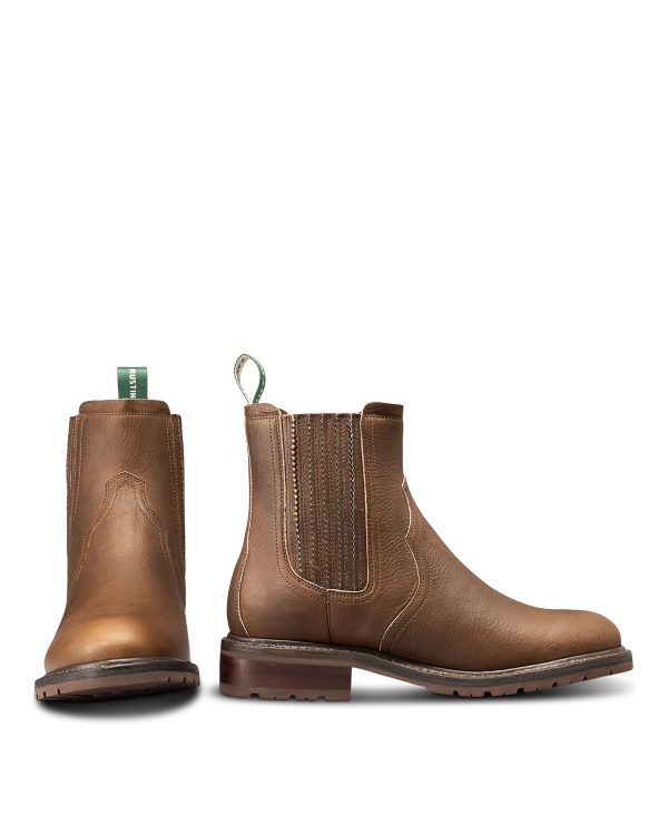 The Chelsea in Cafe Cowhide. Pair of brown leather Chelsea boots crafted from premium Cafe Cowhide with elastic side panels, front and side view shown, featuring pull tabs and low heels.