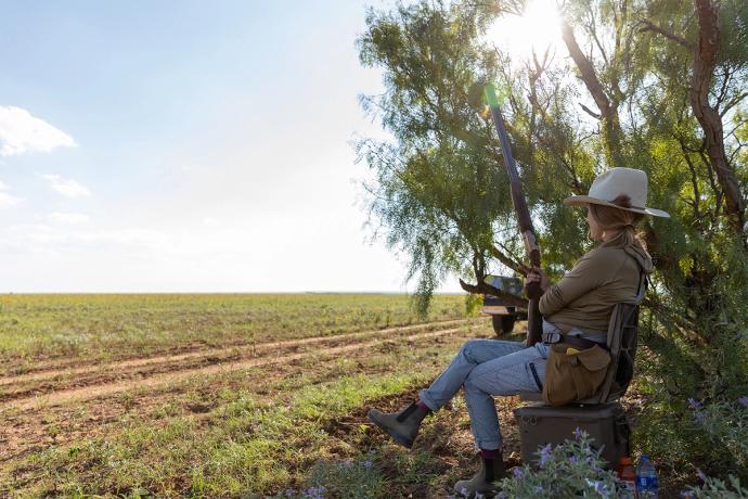 woman sitting looking at a field