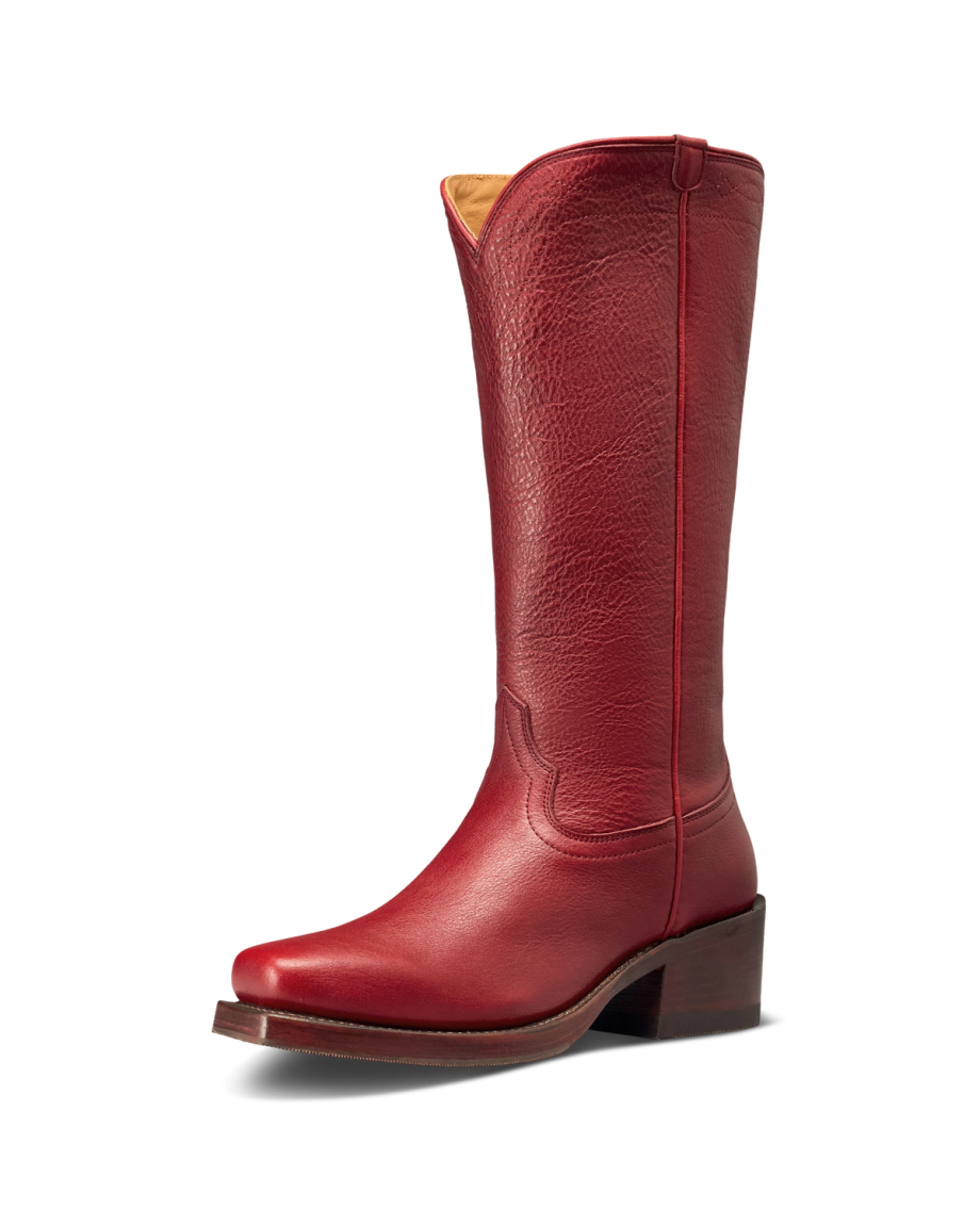 The Charlie in Scarlet Cowhide. A single tall scarlet cowhide leather cowboy boot with a pointed toe, mid-height heel, and decorative stitching, photographed on a white background.