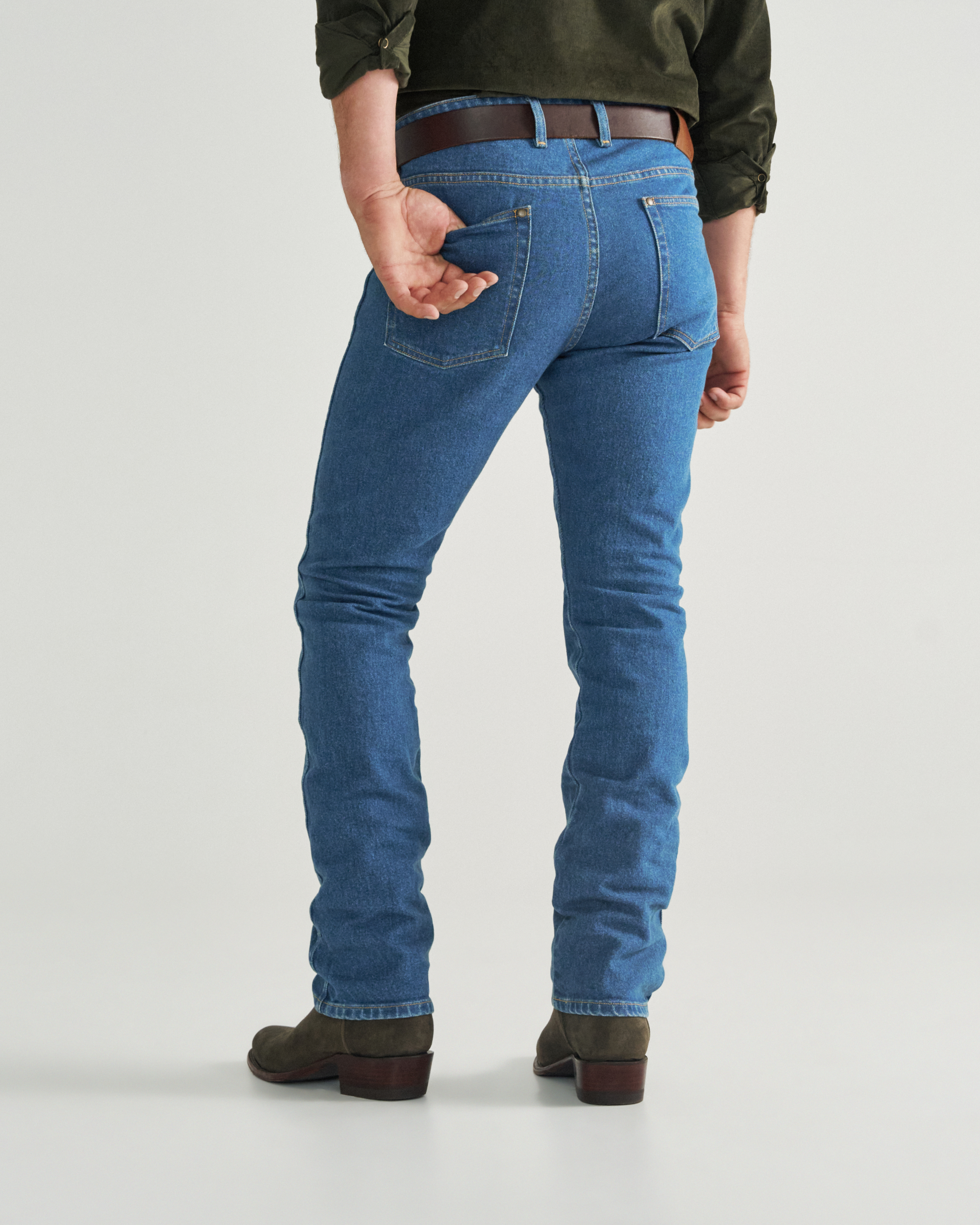 Back view of Men's Slim Straight Heritage Denim - Medium Blue on model