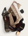 Two pairs of cowboy boots—one brown with a textured pattern and initials "JAM," and one in a snakeskin pattern—are arranged with leather swatches and boot soles on a light background.