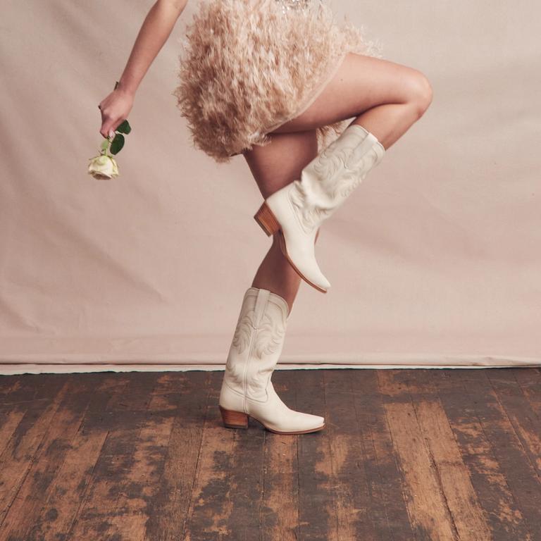 woman posing white cowgirl boots