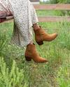 woman in tan sienna suede zip cowgirl booties