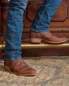 close up picture of Cartwright scotch brown cowboy boots on a man's feet