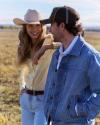 Woman wearing yellow pearl snap and man in denim jacket