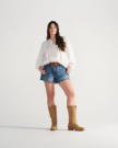 Full view of The Charlie Wide Calf - Camel Cowhide on model