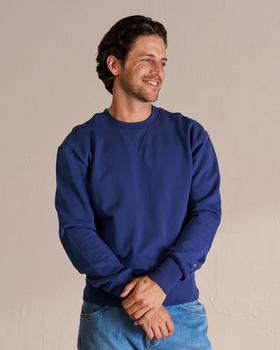 Man wearing the blue old school sweatshirt in a photo studio