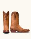 Tan leather cowboy boots with textured brown overlays on the toes, heels, and cuffs.
