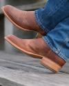 close up picture of Cartwright scotch brown cowboy boots on a man's feet