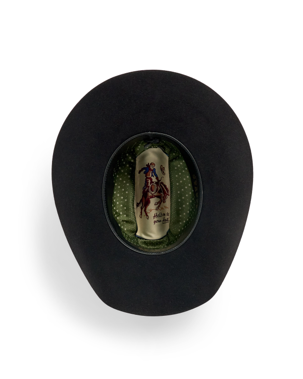Black cowboy hat shown from above, revealing a green polka dot inner lining and a label with a rider on a horse.