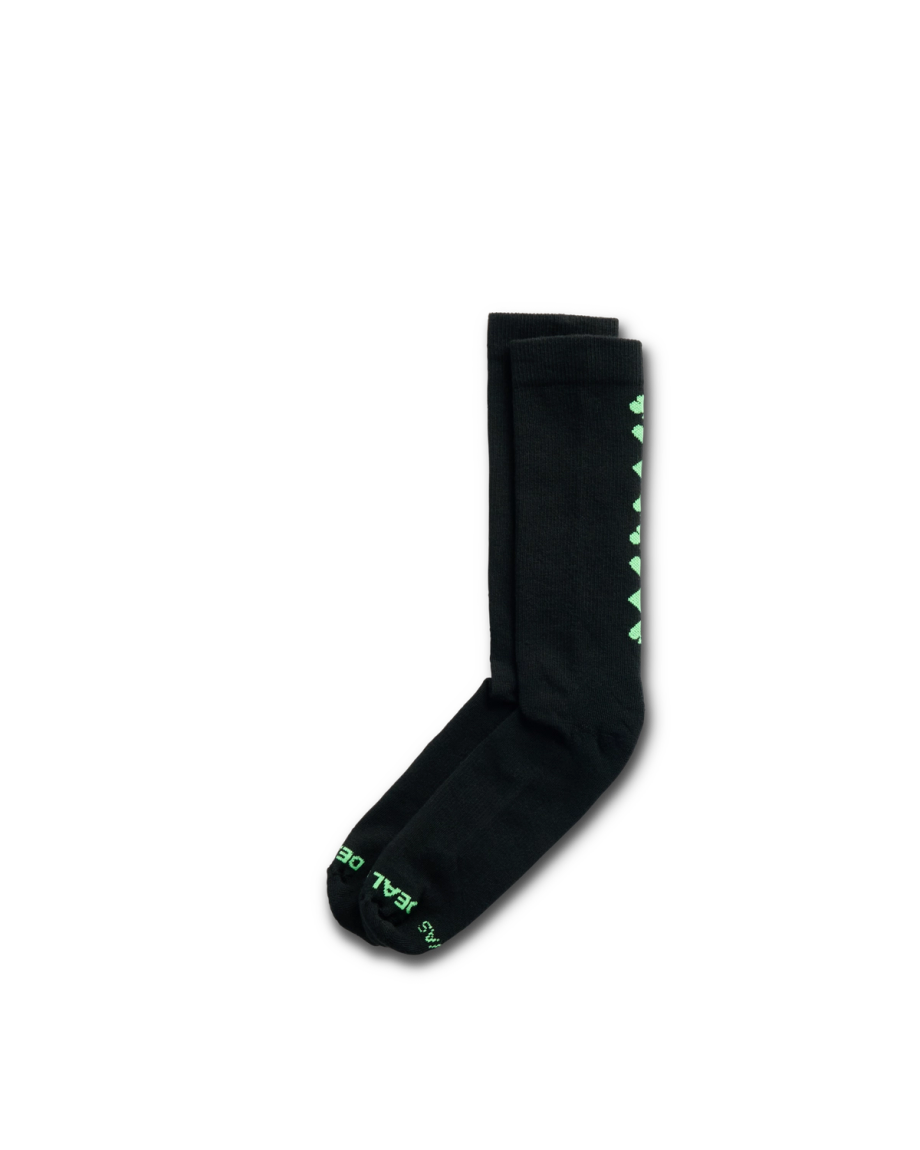 Quarterfront view of Deal Me In Mid Calf Sock - Black / Gamblers Green Black/Gamblers Green Polyester/Spandex on plain background