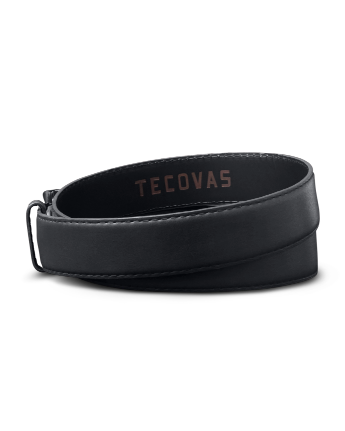 A black leather belt with brown stitching, branded with "Tecovas" on the inner side.