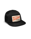 Quarterfront view of Tecovas Patch Flat Brim 6 Panel Trucker - Black on plain background
