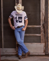 Image of man wearing The Western Varsity Tee in a studio standing outside