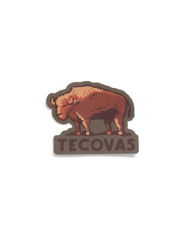 A die-cut sticker featuring a brown bison above the word “TECOVAS” in brown lettering.