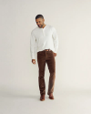 Full view of Men's Slim Straight Stretch Corduroy - Brown on model