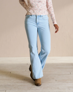 Front view of Women's Mid-Rise Bootcut Jeans - Light on model