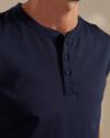 Man wearing the navy henley in a photo studio