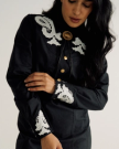 Closeup detail view of Women's L/S Applique Mini Dress - Black