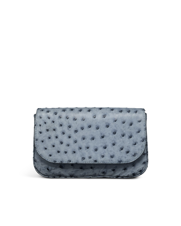 A small, rectangular, blue-gray handbag with a textured surface and a flap closure, set against a plain white background.