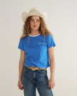 Front view of Women's Vintage Ringer Tee - Blue / White on model