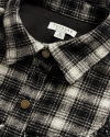 Closeup detail view of Women's Plaid Fringe Shacket - Black / White