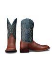 The Doc in Burnt Umber / Blue Cowhide. A pair of cowboy boots with burnt umber cowhide foot and heel, and a blue shaft featuring white decorative stitching. One boot is shown from the front, the other from the side.