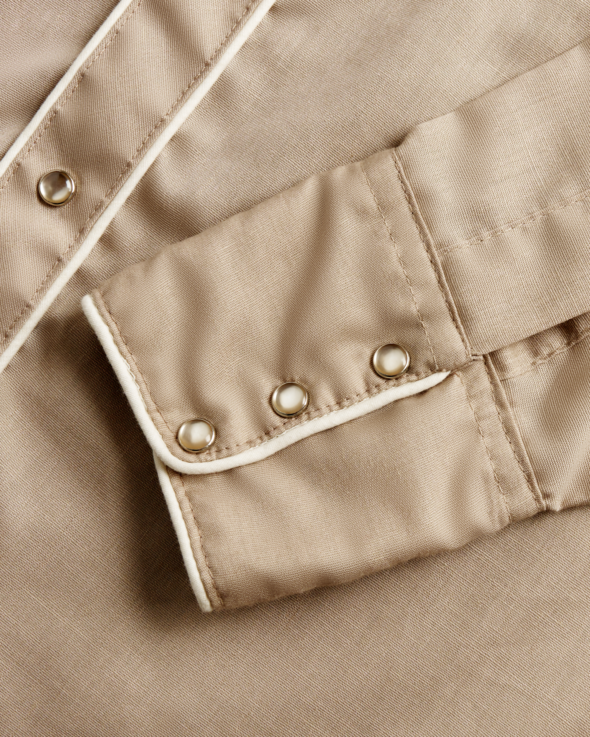 Closeup detail view of Tecovas x Cathy Hahn Men’s Vintage Western Pearl Snap - Tan / Chocolate