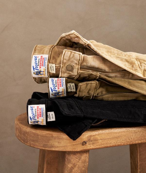 A stack of pants on a stool.